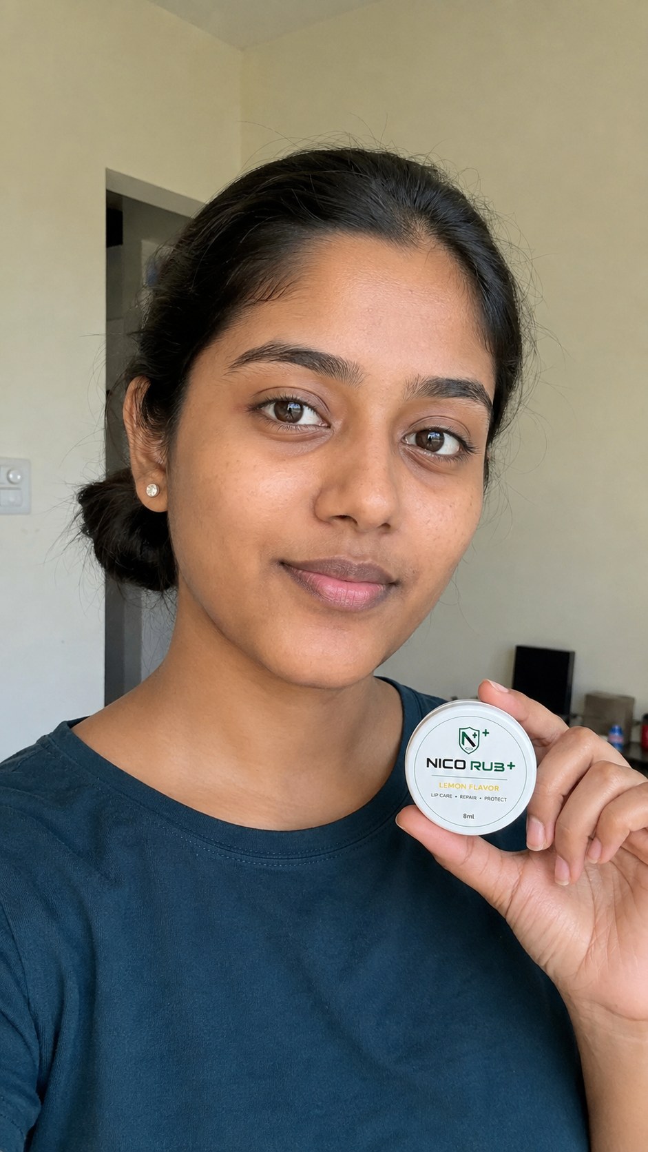 Customer holding NICO RUB+ Lemon lip balm